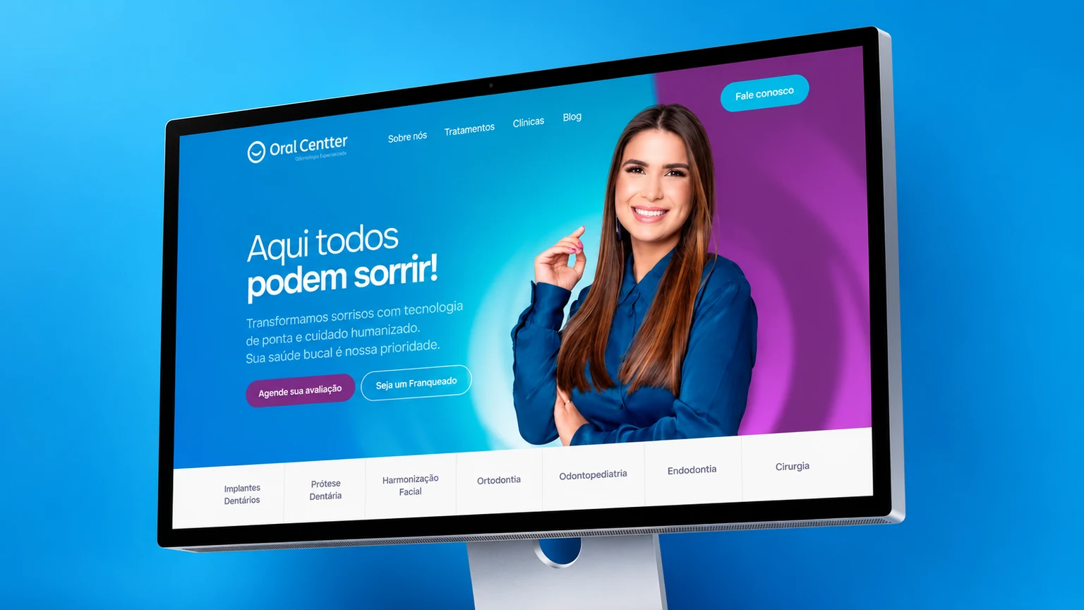 Site Oral Centter apresentado em monitor sobre fundo azul